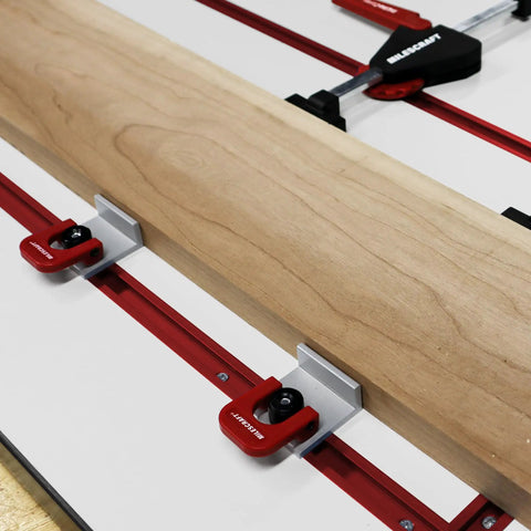 Inline Clamps T Track Clamp Two Pack With Cam Stops for woodworking in use with wooden board on red T-track system.
