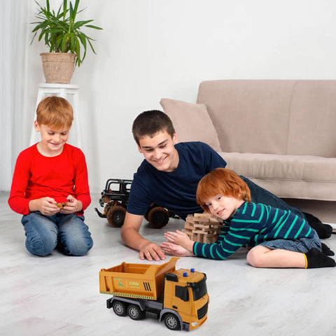 Children playing with Remote Control Dump Truck Toy with Blue Warning Lights, realistic RC construction vehicle indoors.
