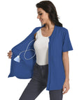 Woman wearing Cozy Post Surgery Mastectomy Shirt With Drain Pockets For Recovery Breathable Cotton Blend Easy Care in royal blue.