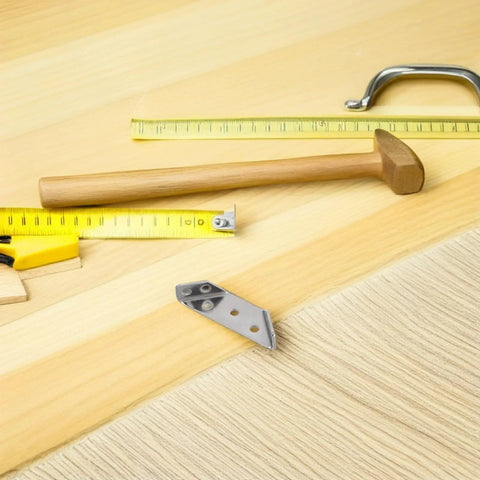 Three Sided Corner Bracket Set In Stainless Steel With Screws for Wood Furniture And Shelves on wood surface with tools