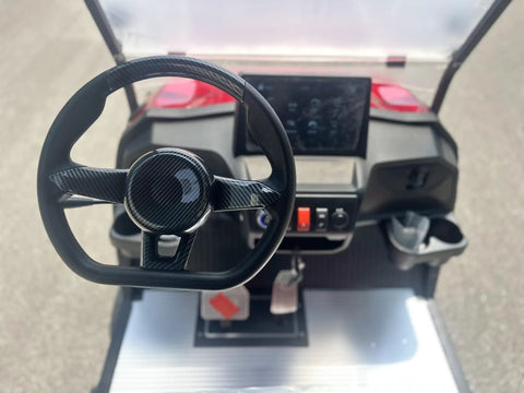 Interior view of the HD LED smart dashboard of the Top Tier Four Seater Electric Golf Cart Built With A Solid Front Bumper And Aggressive Off Road Tires.