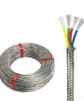 Top Shelf Heavy Duty Four Core Fep Shielded Cable Featuring Stranded Silver Plated Copper Conductors Built To Handle Extreme Heat And Cold Up To Two Hundred Degree Celsius Daily in a coil, showcasing its braided tinned copper.