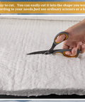 Front view of Amylove ceramic fiber insulation blanket, 60 x 24 x 1 in, white, being cut with scissors.