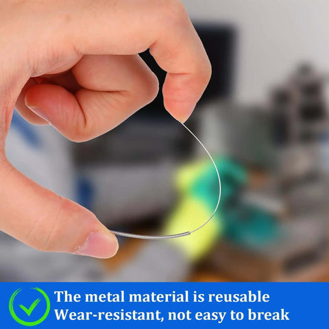 Hand holding a thin stainless steel nozzle cleaning needle from the 10-piece set, reusable and wear-resistant for 3D printers.
