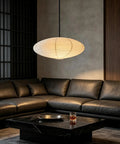 20 Inch Oval Paper Lantern Pendant Light White Rice Paper Ceiling Lamp Japanese Style Diffused Glow Fixture in living room above leather sofa