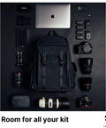 Large Customizable Camera Backpack For Pro Photographers With 16 Inch Laptop Pocket And Exterior Tripod Straps displayed with gear