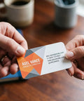 Two hands exchanging a professional card with contact details, showcasing a design using Top Shelf Blank PVC Cards CR80 Size White Plastic.