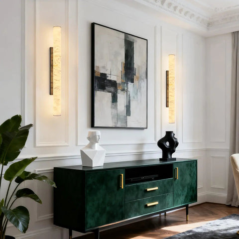 Natural Alabaster Wall Sconces Set Of Two Cylinder LED Wall Lights With Matte Black Metal Base Modern Smooth Glow For Living Room Bedroom And Bathroom mounted beside abstract art.