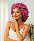 Silk Sleep Bonnet For Women With Adjustable Straps And Tie Band, Large Hair Wrap, Dark Pink, shown on a woman indoors