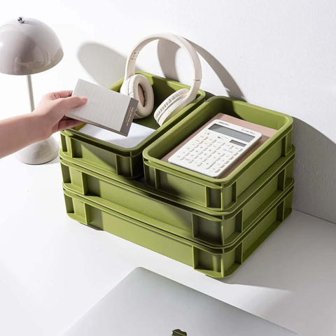 Heavy Duty Stackable Plastic Storage Bin For Kitchen, Bathroom, Office And Camping, Multi Purpose Organizer Tote, Green 2L And 2S used for storing office items like headphones and calculator.