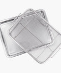 Two Piece Air Fryer Oven Basket Set With Tray And Grease Trap, silver mesh basket and tray for healthier crisping.