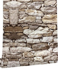 Game Changer Peel And Stick Wallpaper Roll With Lifelike 3D Slate Brick Texture that showcases a beige and gray stone pattern in a roll.
