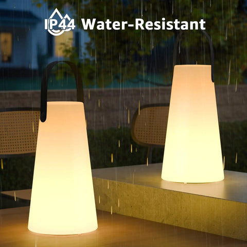 Rechargeable Cordless Outdoor Lanterns With Dope RGB Colors, Remote Control, IP44 Water Resistant on a table in the rain
