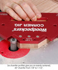 Heavy Duty Cast Aluminum Router Corner Jig And Chamfer Template Set With Six Precise Guides mounted on wood for clean edges.