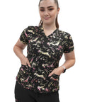 Snag This Very Fresh Women's V Neck Scrub Top For Medical And Nursing Uniforms Graphic Splatter Print Performance Fit Work Wear For Healthcare Pros on a model with pockets.