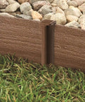 Landscape Fabric Edging And Fencing Brown 3 Inch By 40 Foot With Dope Wood Grain Texture separating grass and rocks