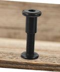 Tough As Nails M6x25 Stainless Steel Binding Post Screws For Leather Bags And Saddle Work premium fastener on wood surface.