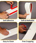 Creamy White Flexible Baseboard Molding Trim Peel And Stick Wall Trim Waterproof Edge Guard 4 Inch Wide By 16.4 Feet Long DIY Friendly Soft NBR Foam Material showing self-adhesive, soft texture, easy cleaning, and cropping ability in action.