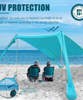 Portable Beach Tent Sun Shelter 7x7ft Shade Canopy UPF50 Sandbags Included For Easy Setup Family Camping Fishing Picnics And Backyard Fun Wind Resistant Beach Shade For Outdoor Adventures showing setup on a beach with two people seated underneath.