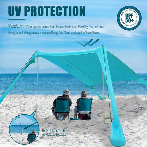 Portable Beach Tent Sun Shelter 7x7ft Shade Canopy UPF50 Sandbags Included For Easy Setup Family Camping Fishing Picnics And Backyard Fun Wind Resistant Beach Shade For Outdoor Adventures showing setup on a beach with two people seated underneath.
