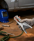 Heavy Duty Welding Ground Clamp With 500A A Shape Copper Jaw held in gloved hand, showcasing stability and ease of use in workshop.