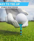Golfer placing ball on 100 Pack 3-1/4 Inch Plastic Golf Tee with Extra Thick Body for Tough Grass, Oversized Head for Easy Tee Up