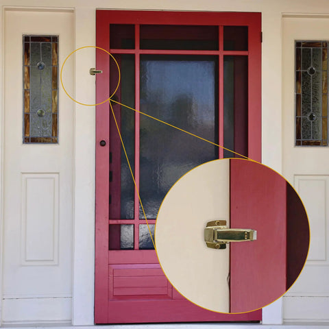 Built Tough Spring Loaded Screen Door Catch Slick Brass Finish Iron Frame keeps entryway secure on red door.