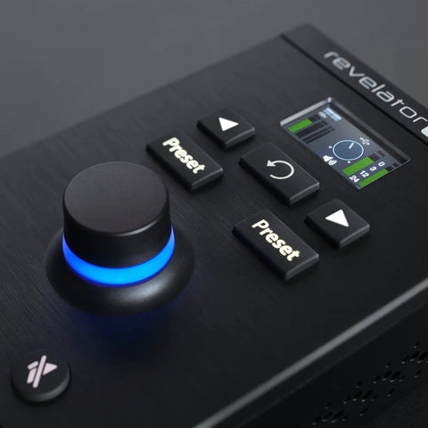 Close-up of ultra compact USB C audio interface, buttons and glowing knob visible, designed for music production and streaming.