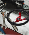 14 Inch PU Racing Steering Wheel With Horn Button For Drift Go Kart Simulator And Off Road Vehicles on workshop table