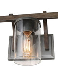 Rustic Faux Wood Three Light Farmhouse Vanity Light With Clear Glass Shades Distressed Black Backing And Decorative Panels Perfect Bathroom Fixture For Warm Ambience Simple Modern Farmhouse Style Upgrade close-up