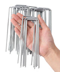 Hand holding Heavy Duty 6 Inch U-Shaped Landscape Staples Set, 120 Pack, 11 Gauge Galvanized Steel Garden Stakes