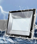JUDYSSY Solar Flood Lights 200W Led Floodlight displayed with water splashes and lightning, ideal for outdoor use.