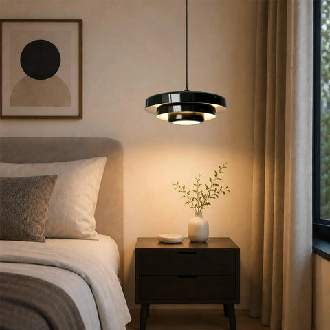 Black Swag Pendant Light Plug in, Mid Century Modern Pendant Lamp with Layered Metal Shade above a bedside table in a cozy bedroom.