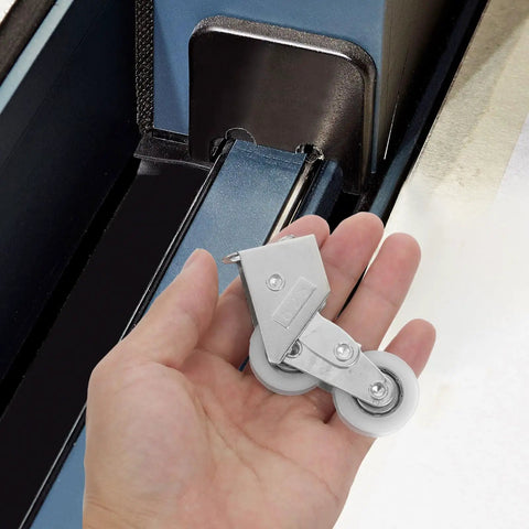Four Piece Heavy Duty Aluminum Pulley Rollers For Smooth Sliding Doors And Windows Straight Up Quick Swap Garage Track Replacement Hardware in hand.