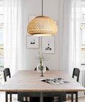 Handmade Flush Mount Ceiling Light With Retro Bamboo Dome Shade, illuminating dining room, hanging above wooden table.
