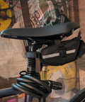 Bike Suspension Seat Post With Adjustable Spring Coil Damper, 27.2/30.4/30.9/31.6mm Diameters, shown with attached bike bag.