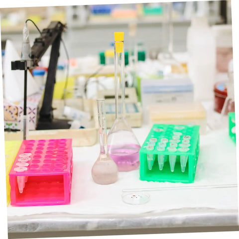 Top Tier Assorted High Temp Silicone Rubber Tapered Plug Kit With 8 Sizes For Caulking Tubes Sealing Caps Plus Flasks Test Tubes Tanks And Bottles That Stand Up To Serious Heat And Work Like A Champ. Assorted silicone plugs in pink and green racks for lab flasks and test tubes