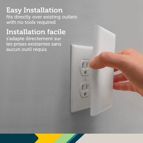 Hand installing OutSmart Outlet Shield 2 Pack With Paintable Decoy Panels For Unused Outlets Easy No Tools Install Kidproof Safety