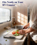 Person using Double Sided Cutting Board With Stainless Steel Edge And Wheat Straw Side Non Toxic Chopping Board with vegetables
