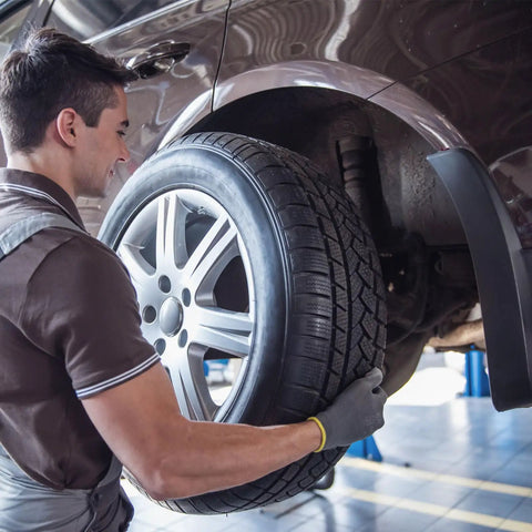Mechanic installing car tire using Spare Tire Lug Wrench 17mm Carbon Steel L Type Slotted End Hex Socket L Shaped Tire Repair Tool.