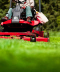 Lawn mower in action using Nonstick Lawn Mower Deck Spray With Pressurized Can To Deter Grass Clipping Buildup And Easy Release