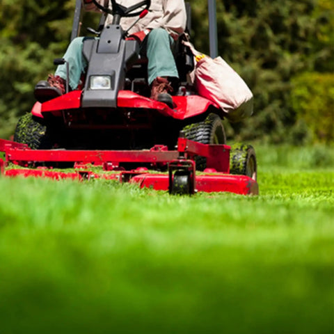 Lawn mower in action using Nonstick Lawn Mower Deck Spray With Pressurized Can To Deter Grass Clipping Buildup And Easy Release