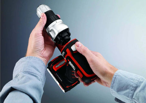 Black+Decker cordless drill with red/black body and metal chuck held by hands