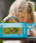 Child examining insects in Two Piece Bug Catcher Kit For Kids, Cool Outdoor Explorer Set With Double Bug Cages in backyard