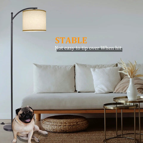 Lit Tall Arc Floor Lamp With Beige Linen Shade near sofa, black finish, stable design, modern standing lamp for living room