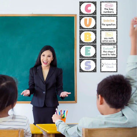 Teacher with students using 10 Piece Math Bulletin Board Set For Classroom Cubes And Problem Solving Posters in classroom