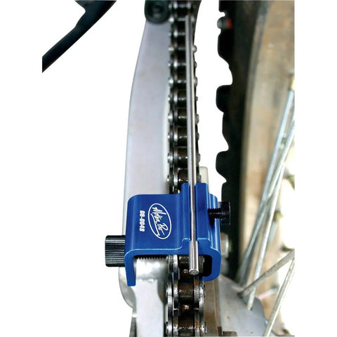 Chain Alignment Tool For Motorcycles And ATVs With Quick Precise Sprocket Alignment And Square Clamp attached to a chain.