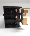 Premium Three Pole Circuit Breaker Delivers 110 Amp At 480 Volt Capacity For Rock Solid Industrial Power Distribution and Electrical Panel Upgrades With A Killer Sixty Five Kiloamp Short Circuit Rating Guaranteeing New Stock Performance Reliability - Front view of black breaker with metal contacts.
