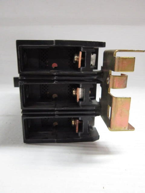 Premium Three Pole Circuit Breaker Delivers 110 Amp At 480 Volt Capacity For Rock Solid Industrial Power Distribution and Electrical Panel Upgrades With A Killer Sixty Five Kiloamp Short Circuit Rating Guaranteeing New Stock Performance Reliability - Front view of black breaker with metal contacts.