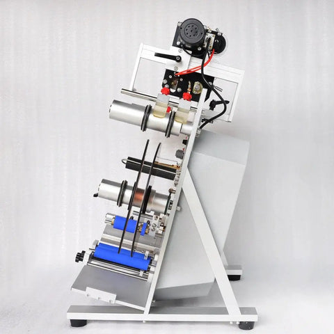 Top Notch Semi Automatic Round Bottle Labeling Machine With A Slick Label Applicator And 110V Wall Plug Power, side view showcasing label rollers and metal construction.